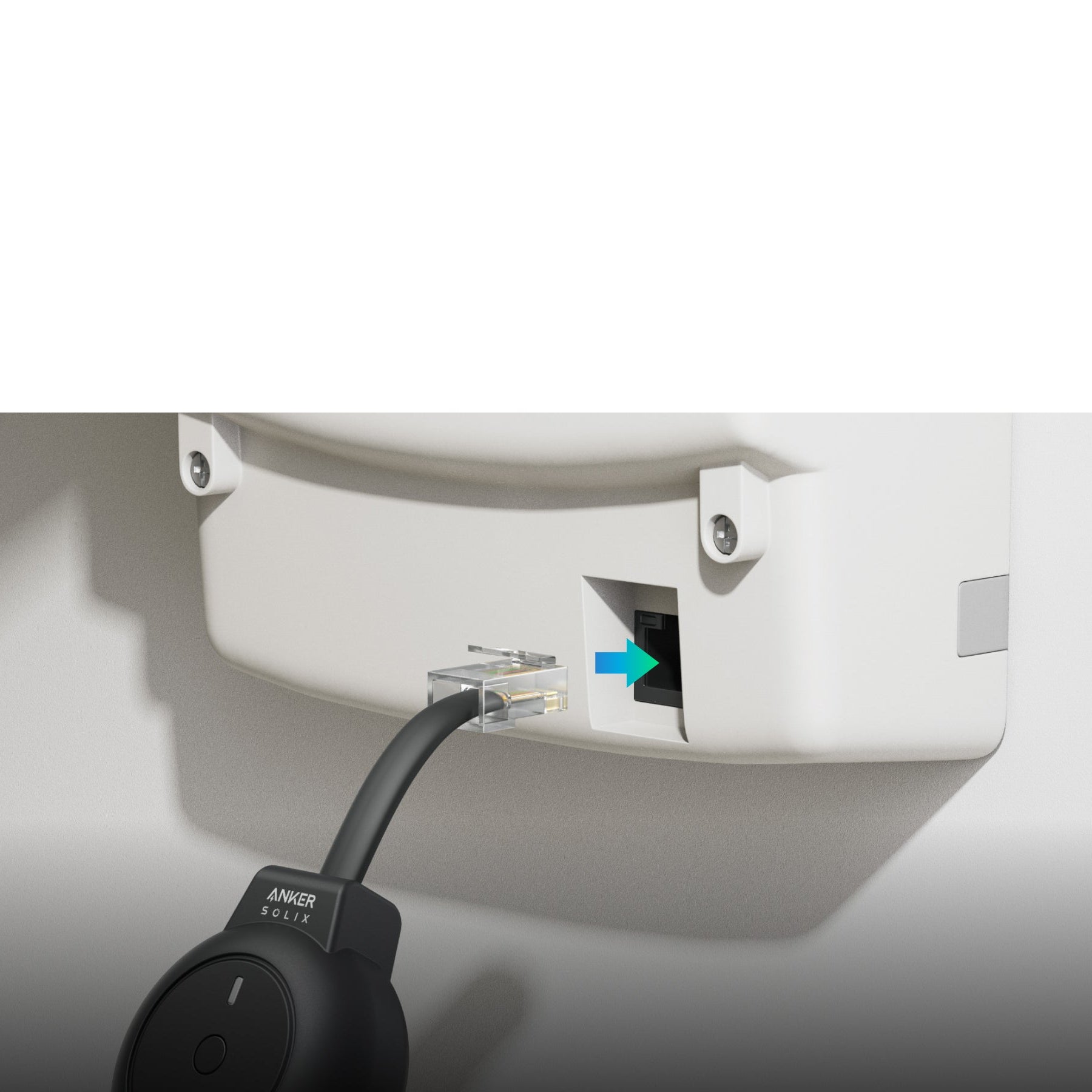 Cable being plugged into a wall socket with a close-up of the cable label.